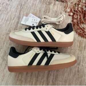 Adidas Women’s Samba in black and cream with gum sole.